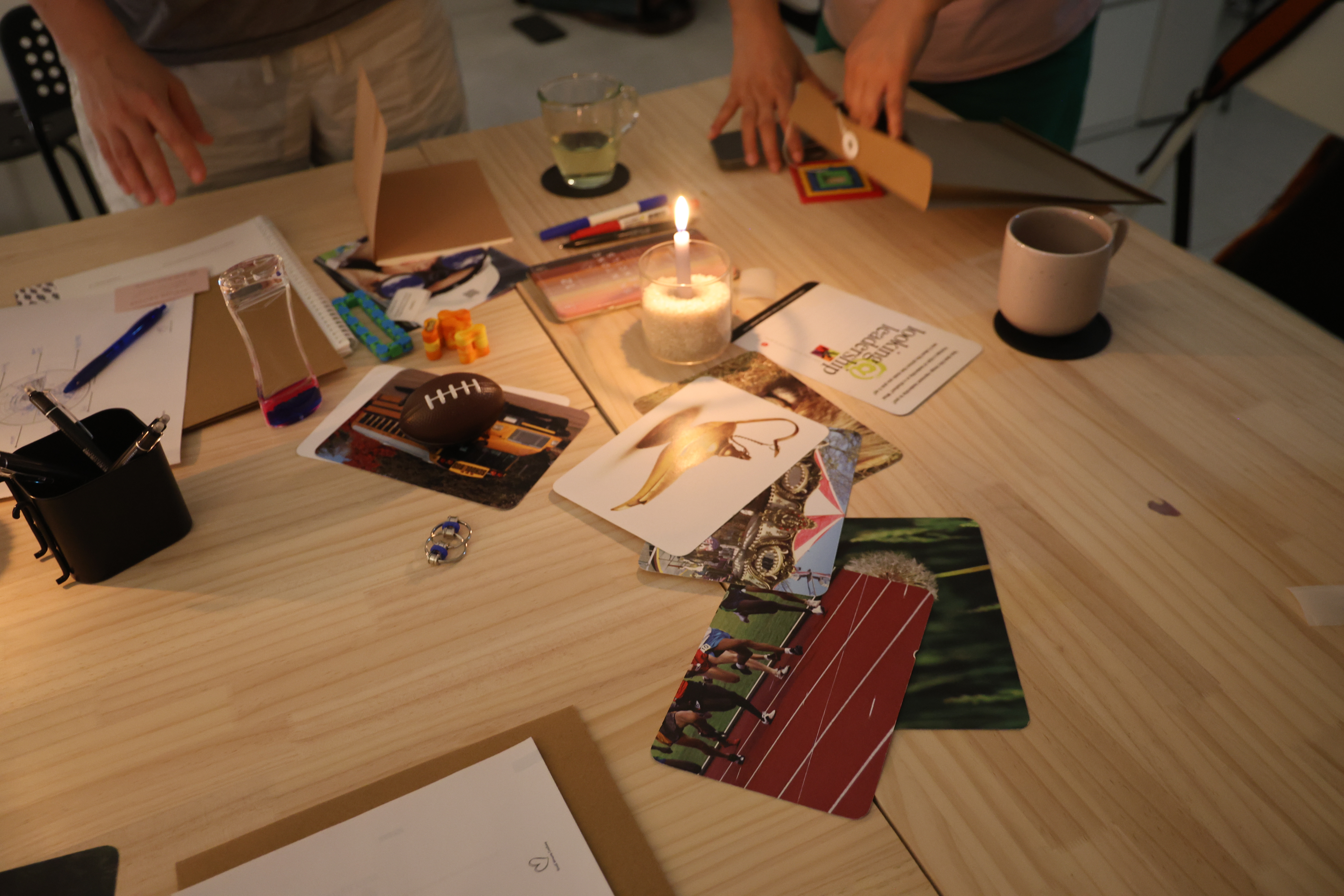 Participants gathered around reviewing materials