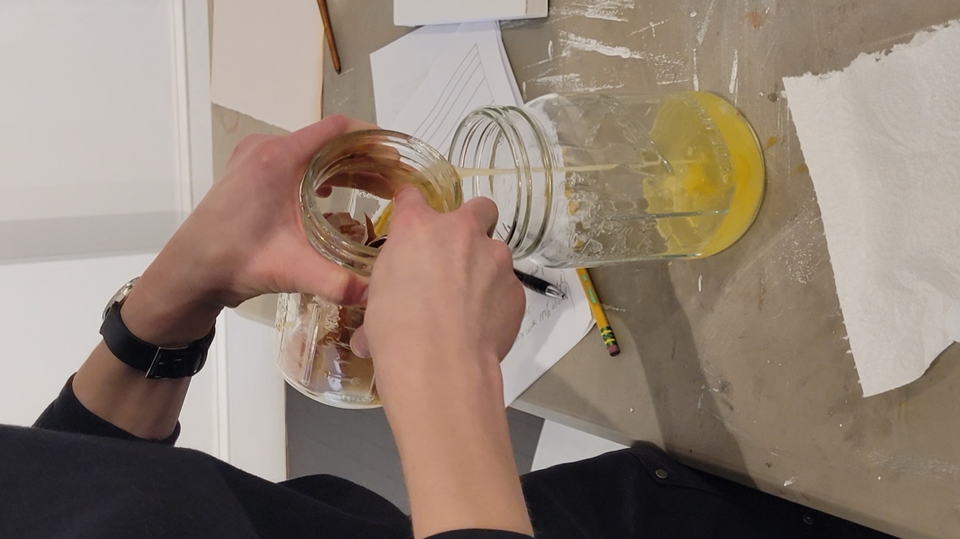 Preparing egg yolk binder in mason jars