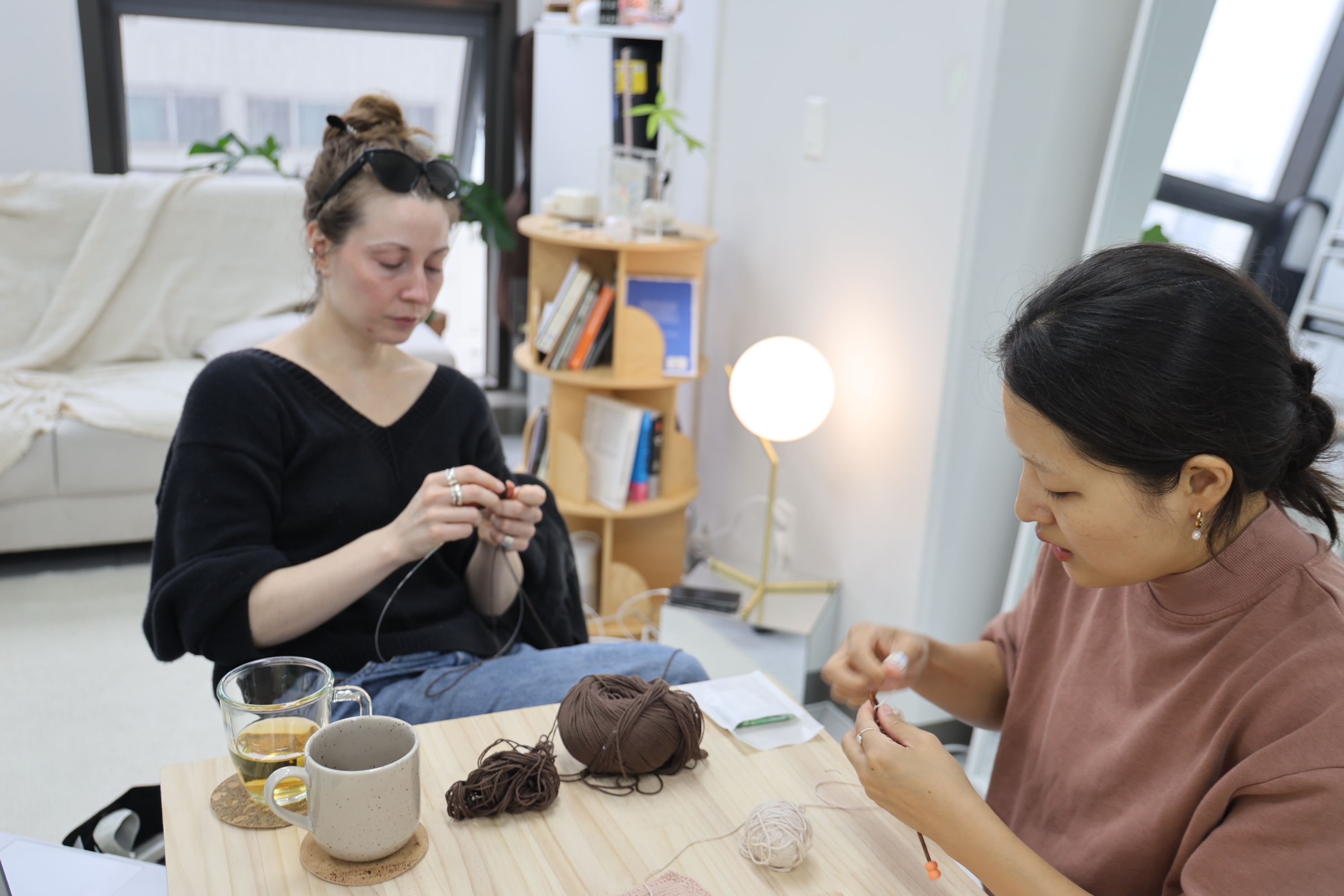 Megan Lucille and participant knitting together at Material Memory Studio, Seoul