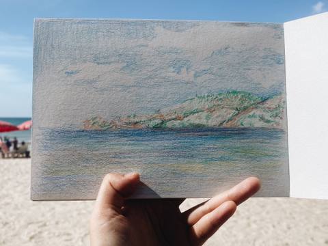 Colored pencil seascape drawn on the beach