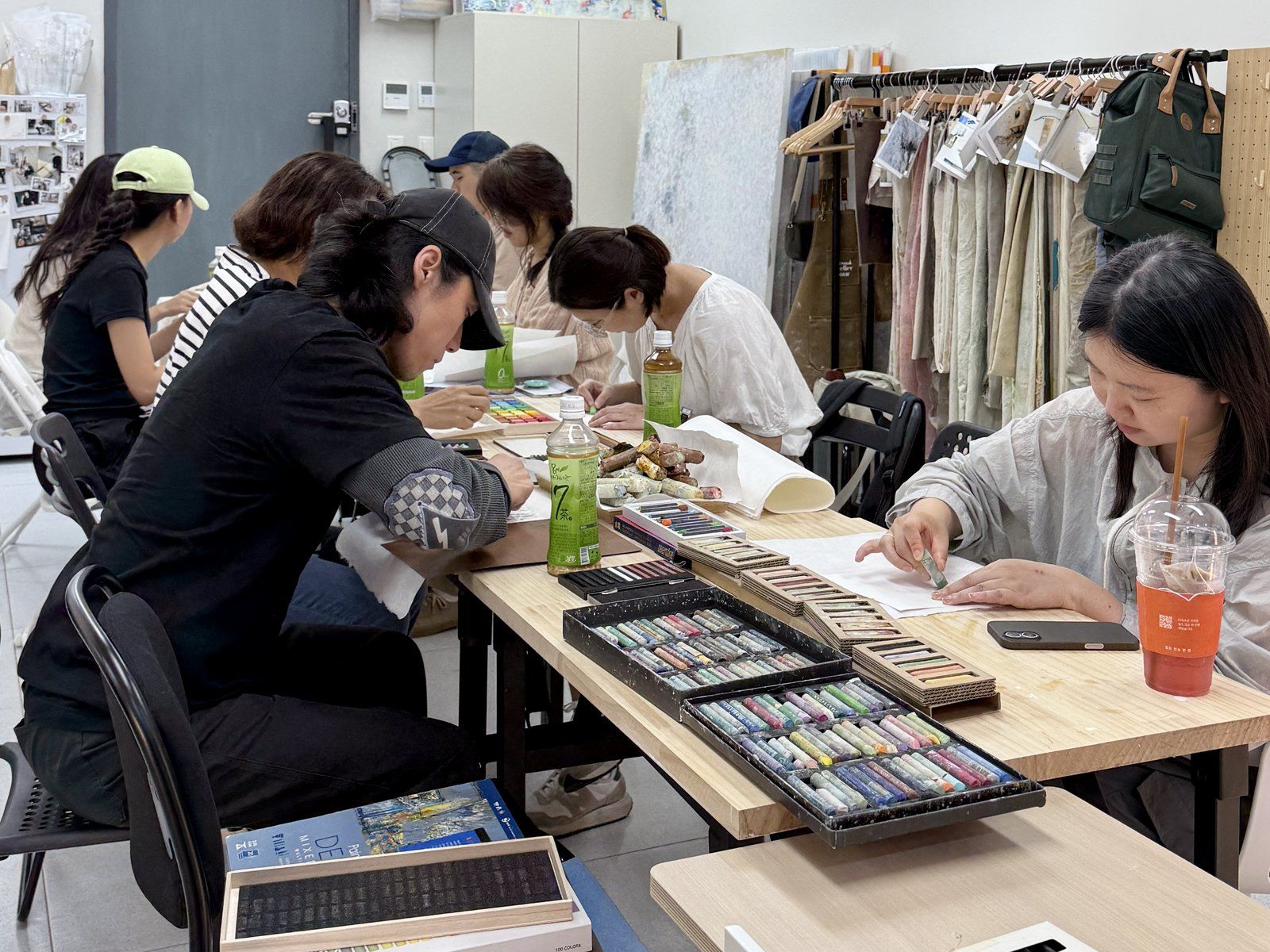 Participants drawing with handmade pastels — Material Lab × AI Archiving, July 8, 2026