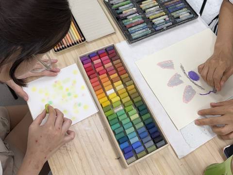 Hands drawing with pastels on paper — Material Lab × AI Archiving, July 8, 2026