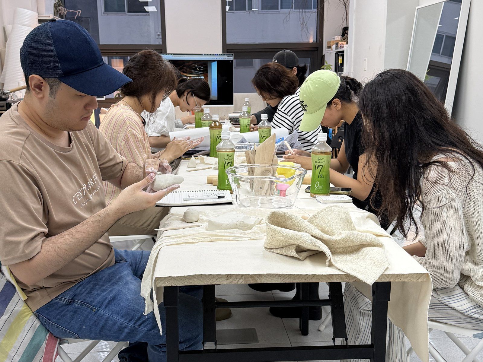 Participants working with clay — Material Lab × AI Archiving, July 8, 2026