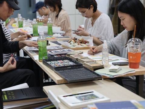 Participants working with handmade pastels — Material Lab × AI Archiving, July 8, 2026
