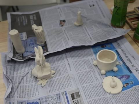 Ceramic objects lined up to dry — Material Lab × AI Archiving, July 8, 2026
