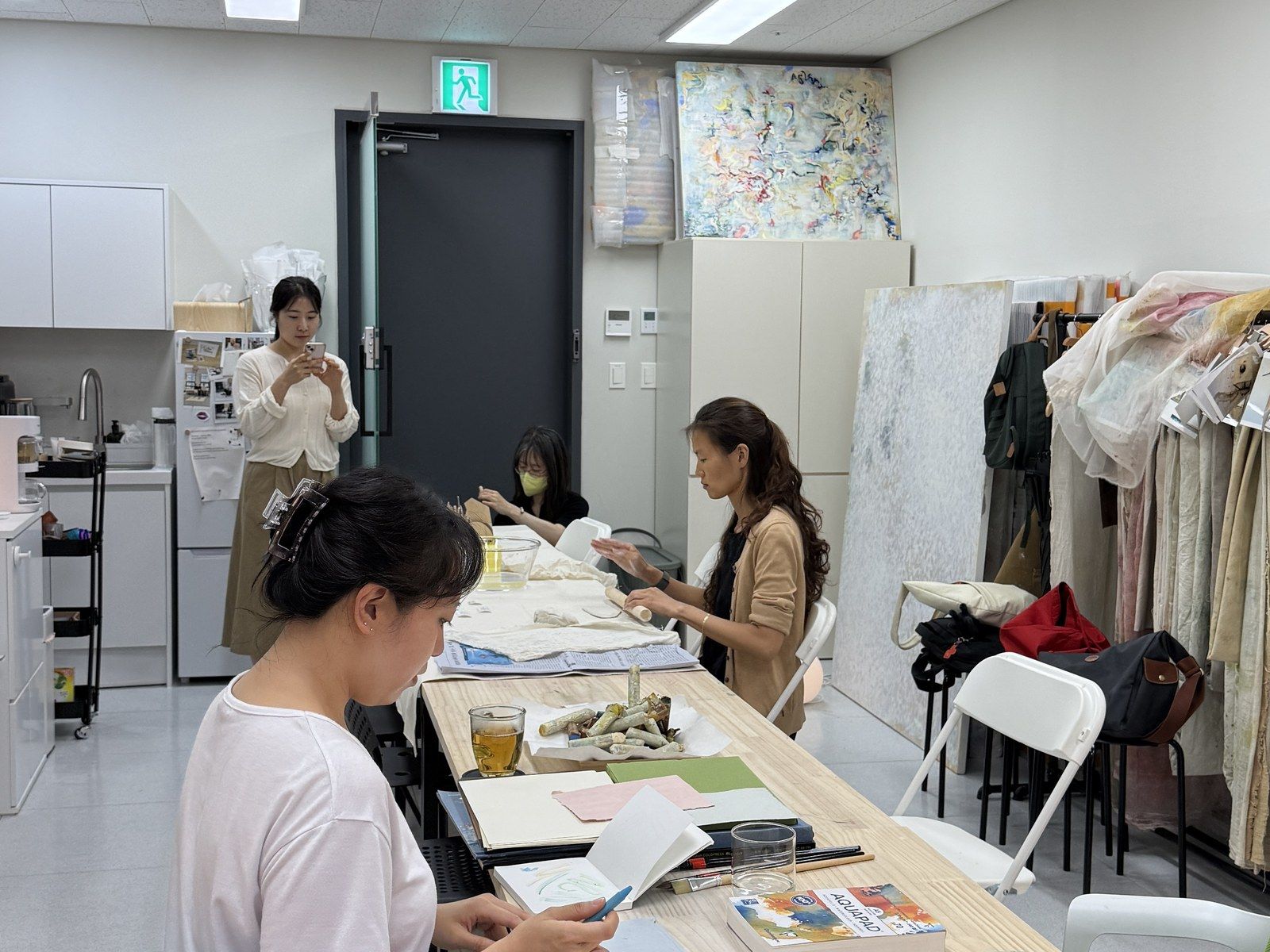 The studio in full swing with participants working — Material Lab × AI Archiving, July 15, 2026