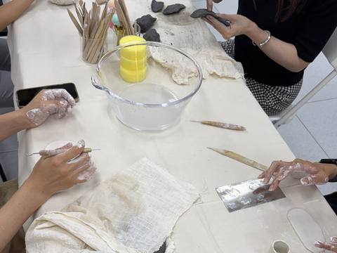 Hands shaping clay at the table — Material Lab × AI Archiving, July 15, 2026