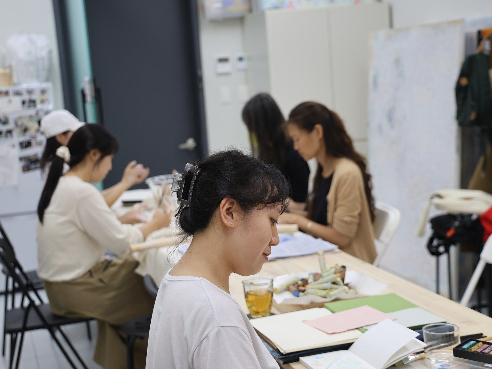 A wide view of participants working across the studio — Material Lab × AI Archiving, July 15, 2026
