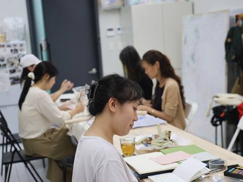 A wide view of participants working across the studio — Material Lab × AI Archiving, July 15, 2026
