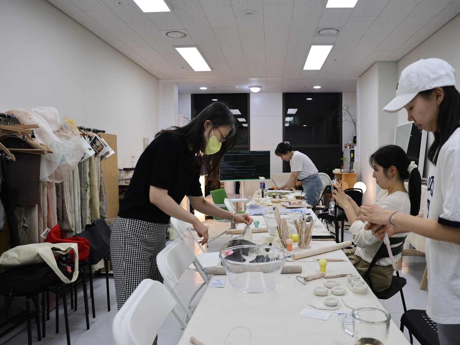 A wide view of participants working, one wearing a mask — Material Lab × AI Archiving, July 15, 2026