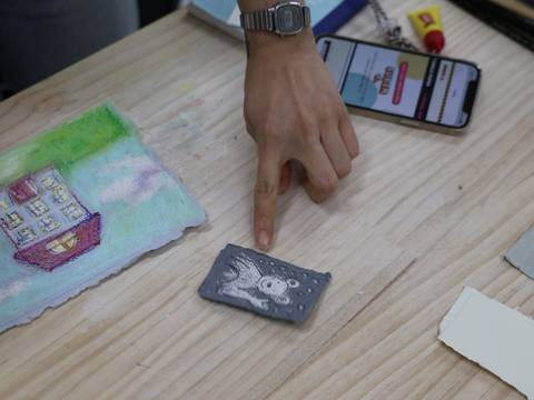 Finished dark clay pieces and small clay balls on cloth — Material Lab × AI Archiving, July 15, 2026